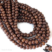 Madre de Cacao Wood Dark Large Hole Round 8.5mm (16-Inch Strand)