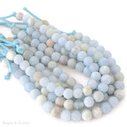Strings of 8mm aquamarine beads with a white background