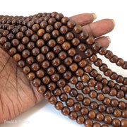 Madre de Cacao Wood Dark Large Hole Round 8.5mm (16-Inch Strand)